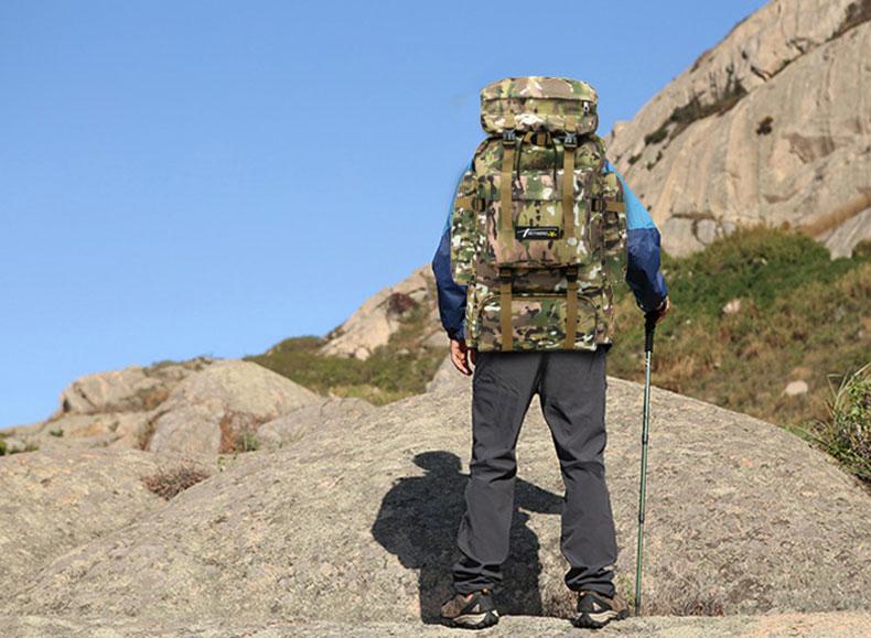 man-hiking-with-large-military-tactical-capacity-bag-for-camping-hiking-traveling