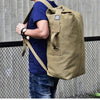 man-with-light-brown-extra-large-traveling-bag-for-hiking-camping-fishing-climbing