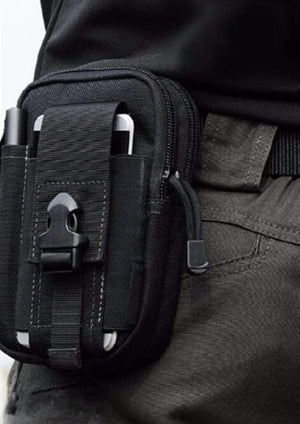 man-carrying-tactical-military-and-army-waist-belt-bag-for-hiking-climbing-fishing